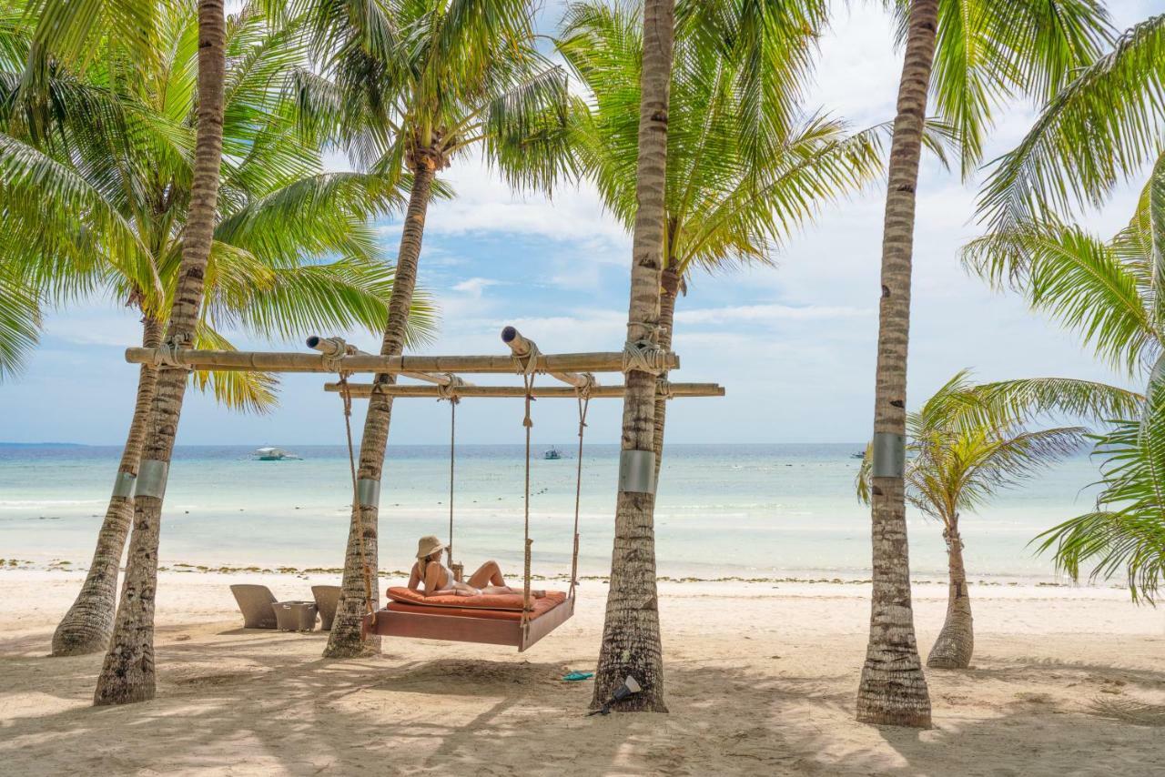 Oceanica Resort Panglao, Bohol Exteriör bild A swing at the beach