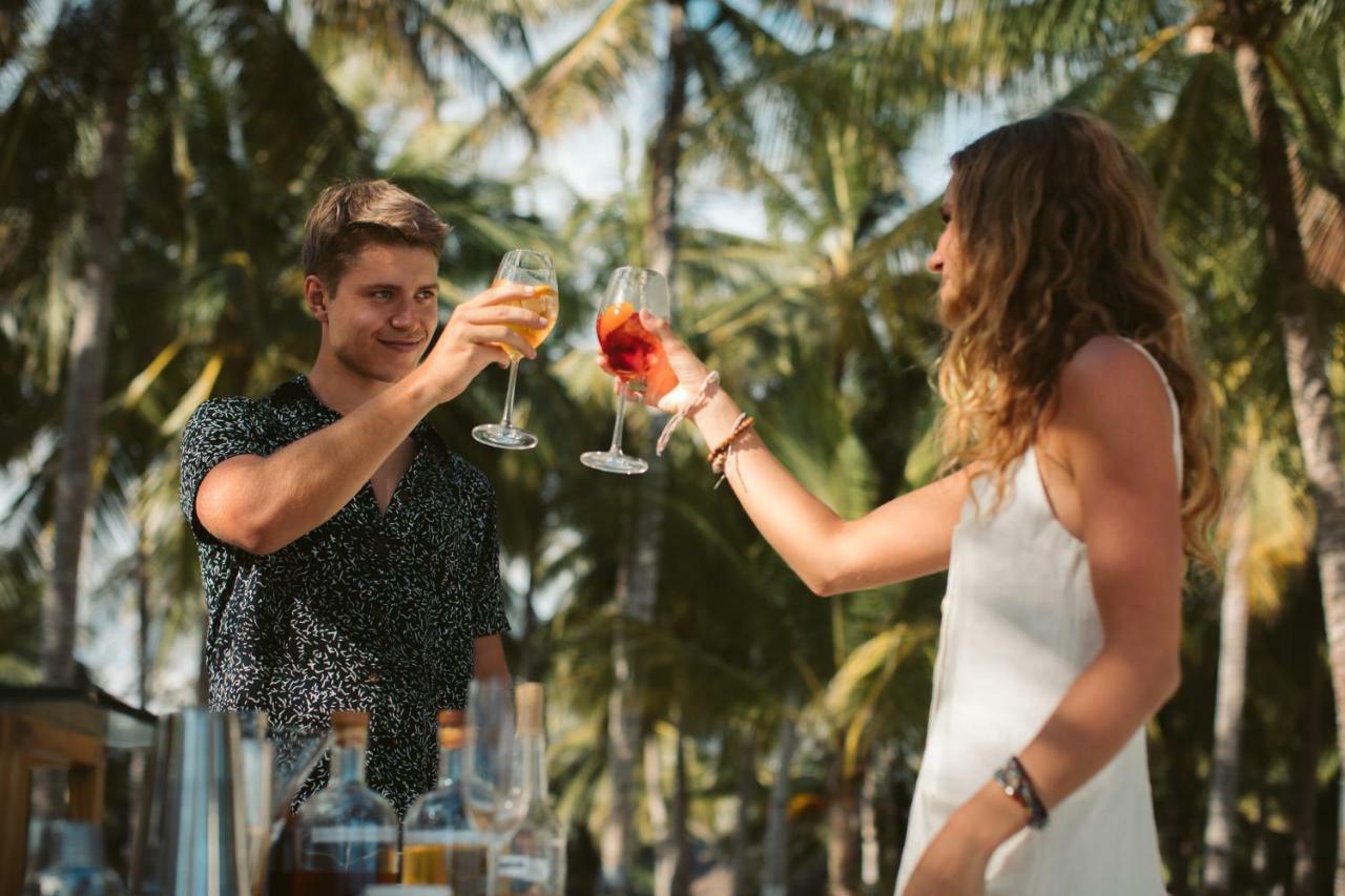 Oceanica Resort Panglao, Bohol Exteriör bild Two people toasting with wine